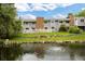 A scenic backyard featuring a tranquil pond and lush greenery, perfect for relaxation and outdoor enjoyment at 2856 S Kenton Ct, Aurora, CO 80014