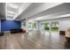 Bright basement with access to outdoor area, features modern lighting and versatile space for recreation or storage at 2856 S Kenton Ct, Aurora, CO 80014