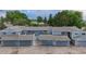 This property features an exterior view of townhomes with attached garages and mature landscaping at 2856 S Kenton Ct, Aurora, CO 80014