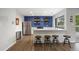 Modern kitchen with stainless steel appliances, white countertops, and stylish floating shelves at 2856 S Kenton Ct, Aurora, CO 80014