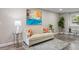 Comfortable living room showcasing neutral tones, stylish decor, and plenty of natural light at 2856 S Kenton Ct, Aurora, CO 80014