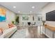 Bright living room features hardwood floors, contemporary decor, and ample natural light at 2856 S Kenton Ct, Aurora, CO 80014