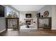 Inviting living room with a cozy fireplace and large windows providing ample natural light at 2856 S Kenton Ct, Aurora, CO 80014