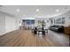 Spacious gathering room complete with kitchen, sliding glass doors to a porch, and large seating areas at 2856 S Kenton Ct, Aurora, CO 80014