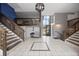 Elegant condo lobby with beautiful tile, stairway and second story lounge area at 2856 S Kenton Ct, Aurora, CO 80014