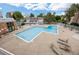 A clean, well-maintained pool area with lounge chairs for relaxation under a blue sky and clouds at 2856 S Kenton Ct, Aurora, CO 80014