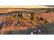 Aerial view of a large property and home with extensive trees, fencing, and landscaping in a rural setting at 7645 Fox Creek Trl, Franktown, CO 80116