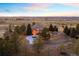 Expansive aerial view showcasing the home's large lot, trees, and mountain views at 7645 Fox Creek Trl, Franktown, CO 80116