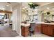 Well-lit bathroom vanity with granite counters, decorative mirrors and sink, next to fireplace at 7645 Fox Creek Trl, Franktown, CO 80116