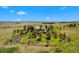 Expansive home with meticulous landscaping, mature trees, and serene views on a sprawling lot at 7645 Fox Creek Trl, Franktown, CO 80116