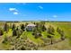 Expansive home with meticulous landscaping, mature trees, and serene views on a sprawling lot at 7645 Fox Creek Trl, Franktown, CO 80116