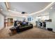 Home theater includes tiered seating, a projector, screen and wet bar for entertaining at 7645 Fox Creek Trl, Franktown, CO 80116