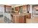 Gourmet kitchen features a large island, wine rack, and stainless steel appliances at 7645 Fox Creek Trl, Franktown, CO 80116