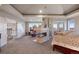 Spacious main bedroom featuring a fireplace, sitting area, and scenic views at 7645 Fox Creek Trl, Franktown, CO 80116