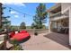 Relaxing outdoor deck with comfortable seating, string lights, and scenic views of the landscape at 7645 Fox Creek Trl, Franktown, CO 80116