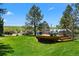 Charming deck with comfortable seating, potted plants, and views of the surrounding landscape at 7645 Fox Creek Trl, Franktown, CO 80116