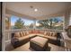 Outdoor patio with sectional seating and scenic views at 7645 Fox Creek Trl, Franktown, CO 80116
