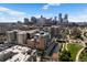 Stunning aerial view of the city skyline with modern apartment buildings and green spaces along the waterway at 1475 Delgany St # 307, Denver, CO 80202
