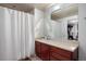 Bathroom with vanity, generous mirror, and combined shower and tub with curtain at 1475 Delgany St # 307, Denver, CO 80202