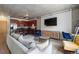 Open-concept living area with a full kitchen, comfortable seating, and stylish decor at 1475 Delgany St # 307, Denver, CO 80202