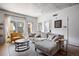 Bright living room boasts a balcony, modern decor, and comfortable seating, perfect for relaxing and entertaining guests at 1475 Delgany St # 307, Denver, CO 80202