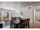 Bright and open living space with a dining table, comfortable seating, and access to a balcony at 1475 Delgany St # 307, Denver, CO 80202