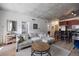 Spacious living room featuring a comfortable sofa, dining area, and stylish modern decor at 1475 Delgany St # 307, Denver, CO 80202