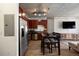 Modern kitchen with stainless steel appliances open to a living area with stylish furnishings at 1475 Delgany St # 307, Denver, CO 80202
