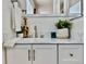 Bright bathroom vanity with neutral finishes, modern fixtures and decor at 180 S Nome St, Aurora, CO 80012