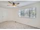 Bright and airy bedroom with a large window and neutral carpet, ideal for a restful retreat at 180 S Nome St, Aurora, CO 80012