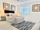 Bright bedroom features a comfortable bed, stylish decor, and plenty of natural light from the window at 180 S Nome St, Aurora, CO 80012