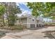 Exterior view showcases gray siding, garage parking, and a townhouse structure in a residential neighborhood at 180 S Nome St, Aurora, CO 80012