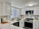 Bright kitchen with sleek countertops, stainless steel appliances, and ample cabinet space at 180 S Nome St, Aurora, CO 80012