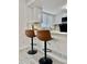 Eat-in kitchen with stylish breakfast bar seating beneath modern pendant lights at 180 S Nome St, Aurora, CO 80012