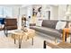 Open-concept living area with contemporary decor, plush sofa, and inviting atmosphere at 180 S Nome St, Aurora, CO 80012