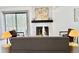 Cozy living room features a fireplace, stylish decor, and comfortable seating area for entertaining at 180 S Nome St, Aurora, CO 80012