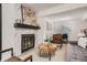 Inviting living room with modern fireplace, stylish furniture, and an open concept layout, perfect for relaxing and entertaining at 180 S Nome St, Aurora, CO 80012