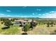 Aerial view of estate, with stucco exterior, clay tile roof and circular driveway at 8611 Coachlight Way, Littleton, CO 80125