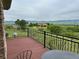 Scenic view from the balcony overlooking lush greenery and distant mountains at 8611 Coachlight Way, Littleton, CO 80125