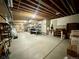 Unfinished basement with exposed beams, concrete floor, ready for customization at 8611 Coachlight Way, Littleton, CO 80125