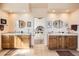 En-suite bathroom featuring double sink vanities and an open doorway to the bedroom at 8611 Coachlight Way, Littleton, CO 80125