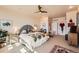 Serene bedroom with a unique headboard, soft lighting, and an oriental rug at 8611 Coachlight Way, Littleton, CO 80125