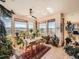 Open and airy dining area with floor to ceiling windows and expansive landscape views at 8611 Coachlight Way, Littleton, CO 80125