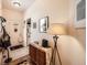 Inviting entryway featuring stylish decor, a wooden cabinet, and a tiled floor, creating a warm welcome at 8611 Coachlight Way, Littleton, CO 80125