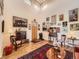 Bright foyer featuring hardwood floors, high ceilings, and an eclectic mix of art and furnishings at 8611 Coachlight Way, Littleton, CO 80125