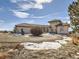 Elegant home featuring a circular driveway and tasteful landscaping on a spacious lot at 8611 Coachlight Way, Littleton, CO 80125