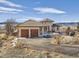 Lovely stucco home with tile roof and two-car garage, offering picturesque views at 8611 Coachlight Way, Littleton, CO 80125