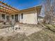 Home exterior featuring outdoor seating area and access to the backyard at 8611 Coachlight Way, Littleton, CO 80125