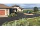 Stunning home with circular driveway, mature landscaping, mountain views and art features at 8611 Coachlight Way, Littleton, CO 80125
