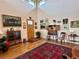 Inviting foyer with hardwood floors, high ceilings, and decorative artwork at 8611 Coachlight Way, Littleton, CO 80125